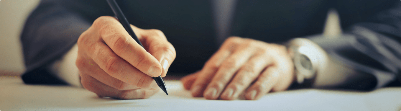 Man signing a tax document