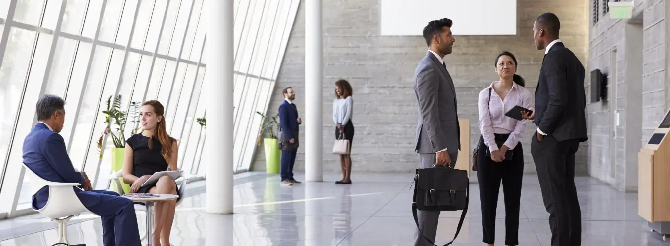 People in a building chatting