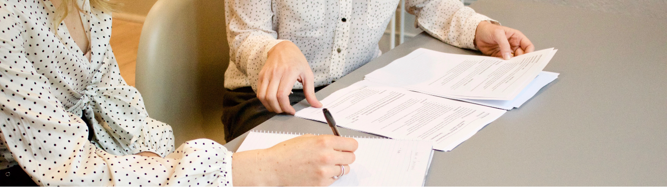 Women looking through documents