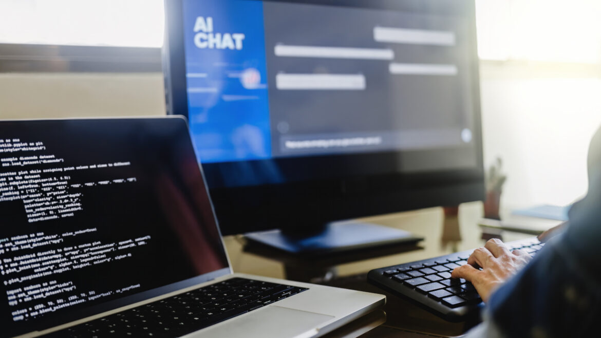 typing on keyboard with laptop and computer screen utc