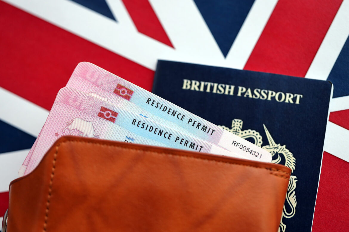 british passport and residence permits on flag utc